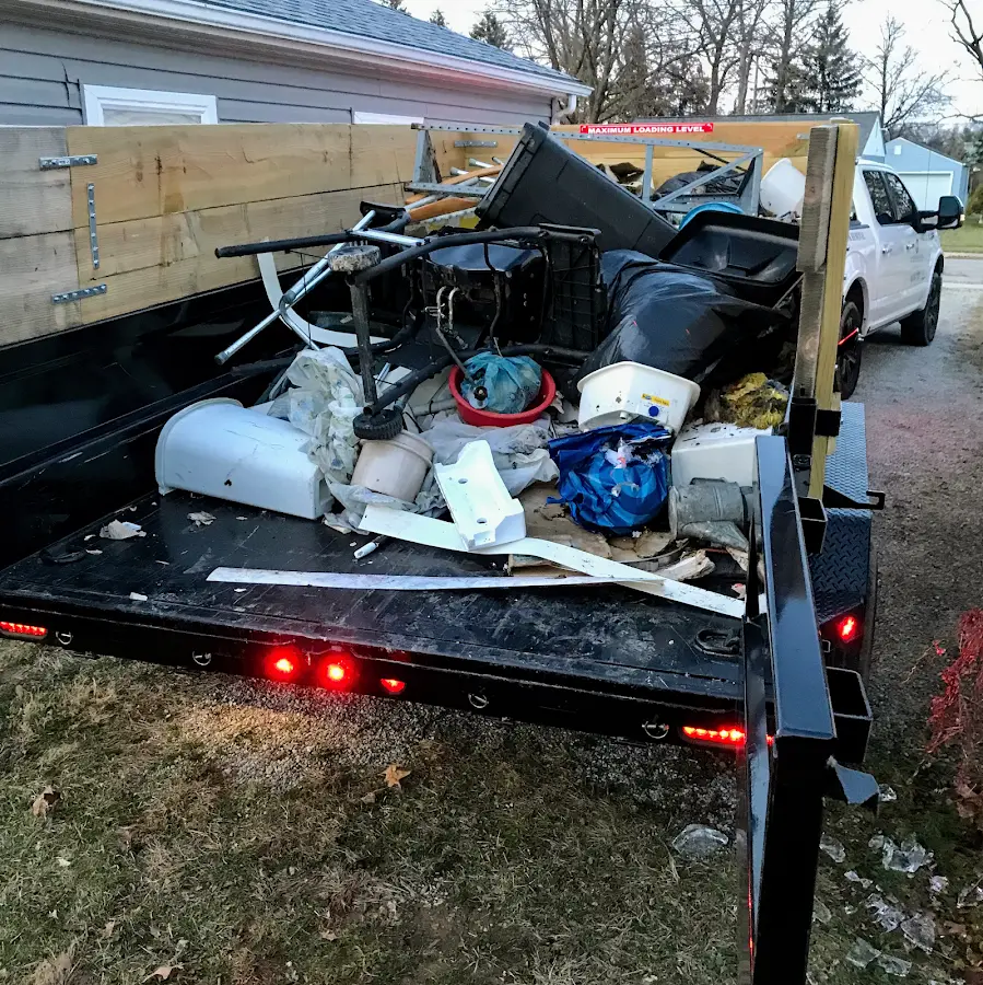 Roll-off dumpster delivered to a residential driveway in Spring Lake