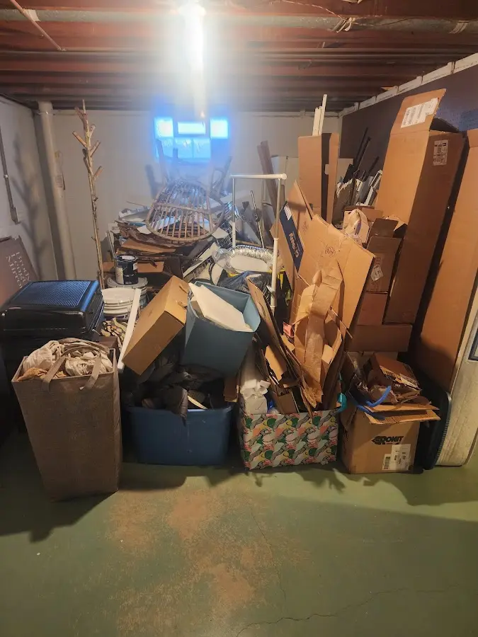 Roll-off dumpster container at job site for 20 Yard Dumpster Rental in Spring Lake